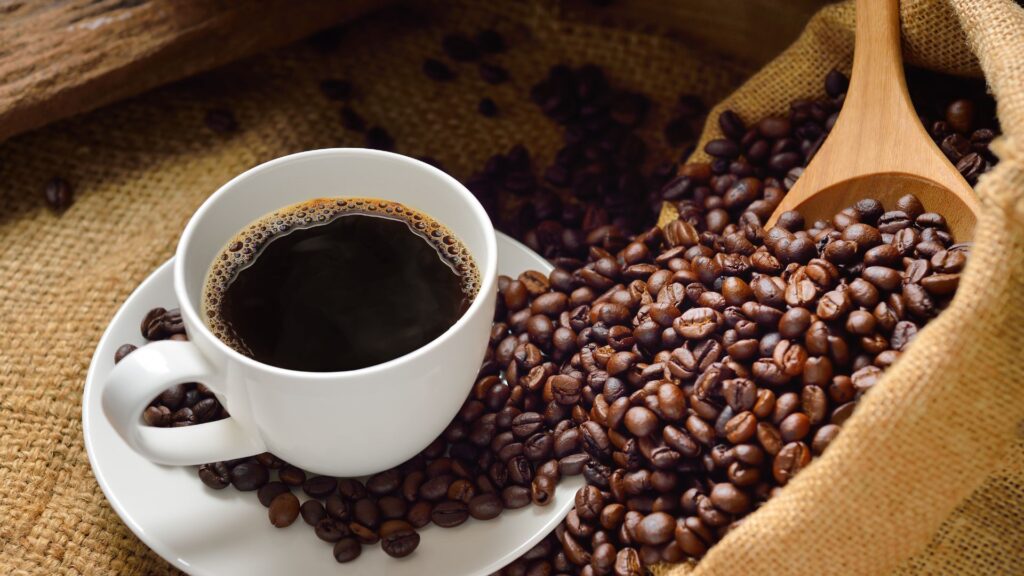 Shot of coffee and coffee beans on burlap background