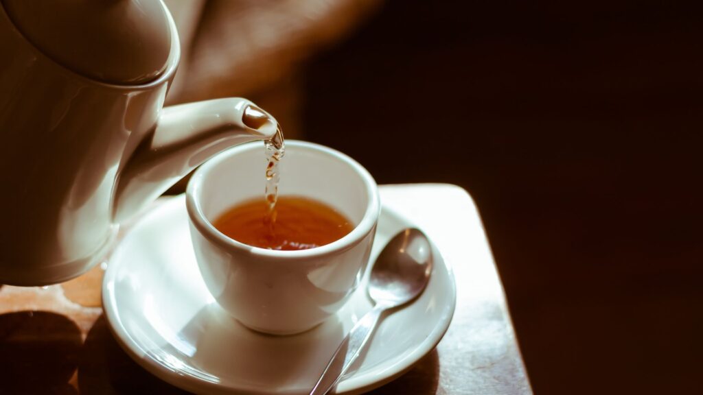 Pouring a cup of golden tea
